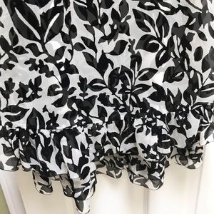 Women’s tiered black and white party dress.